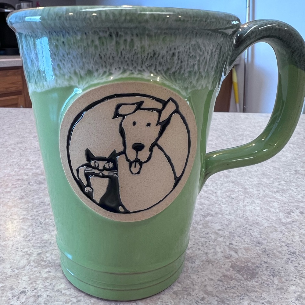 Charming ASPCA Dog and Cat Green Mug with Animal Design